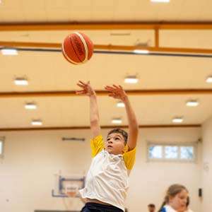 boy playing basketball