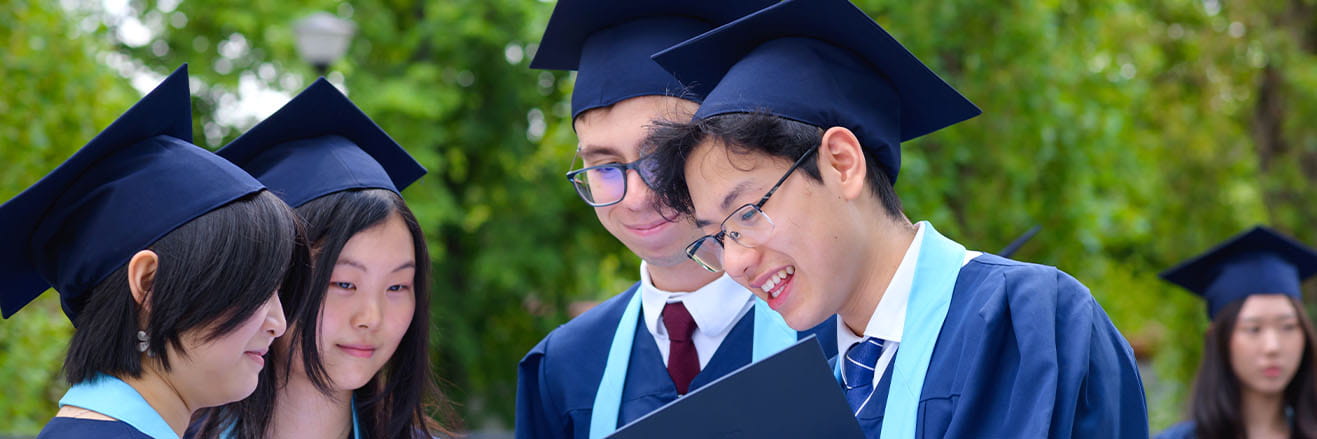 IB students in graduation gowns