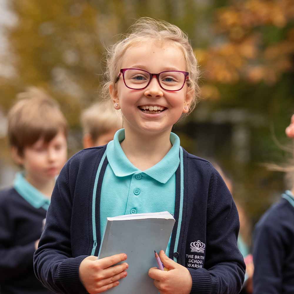 smiling girl with a notebook