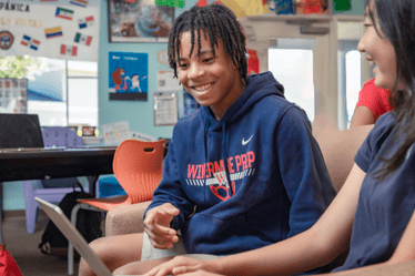 high-school-student-smiling-in-a-classroom
