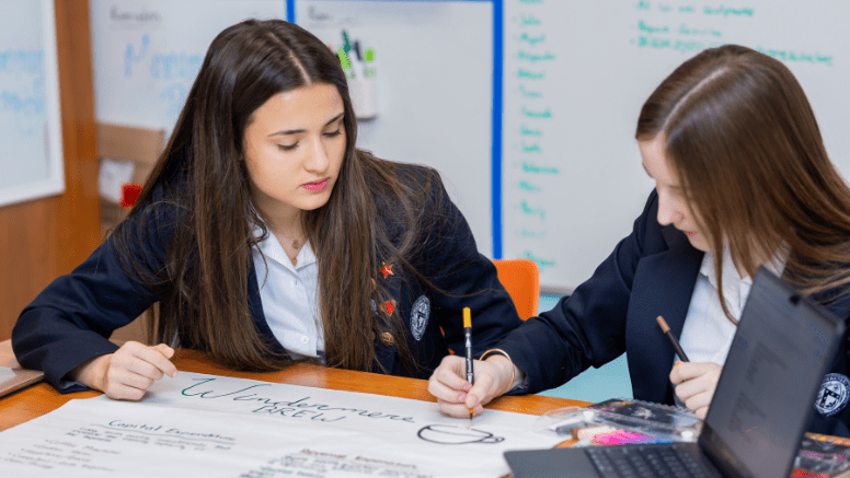 Windermere Prep high school students collaborating on a classroom project.
